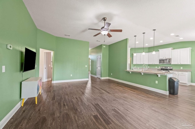 unfurnished living room with visible vents, baseboards, ceiling fan, recessed lighting, and dark wood finished floors