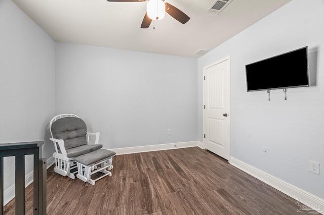 unfurnished room with visible vents, a ceiling fan, baseboards, and dark wood-type flooring