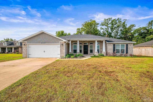 ranch-style house featuring fence, brick siding, a garage, a front yard, and driveway