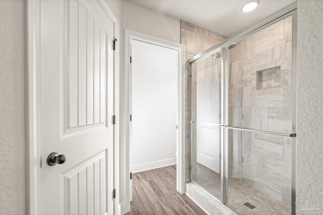 4036 Millwright Way, Pace, FL 32571 - full bath featuring a stall shower and wood finished floors