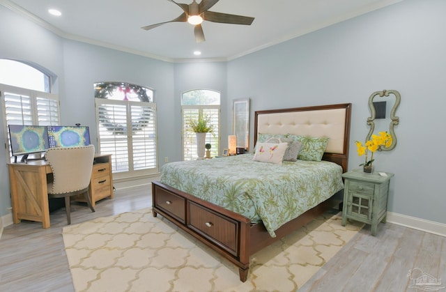 bedroom featuring ceiling fan, light hardwood / wood-style floors, and crown molding