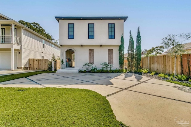 view of front facade with a garage and a front yard