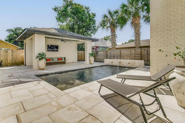 view of swimming pool with a patio area, ceiling fan, and pool water feature