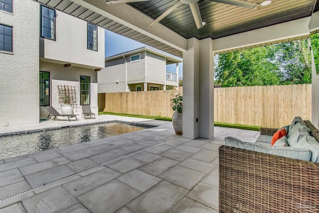 view of patio / terrace featuring ceiling fan