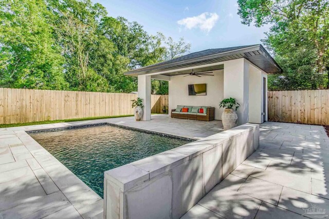 view of swimming pool with ceiling fan and a patio