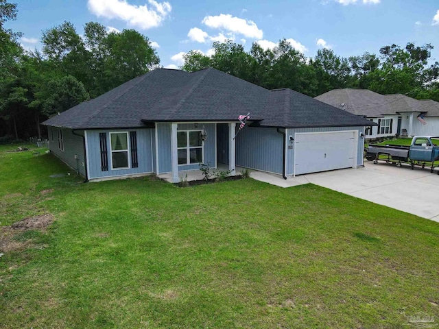 1758 Tate Rd, Cantonment, FL 32533 - ranch-style home with a garage, concrete driveway, a shingled roof, and a front yard