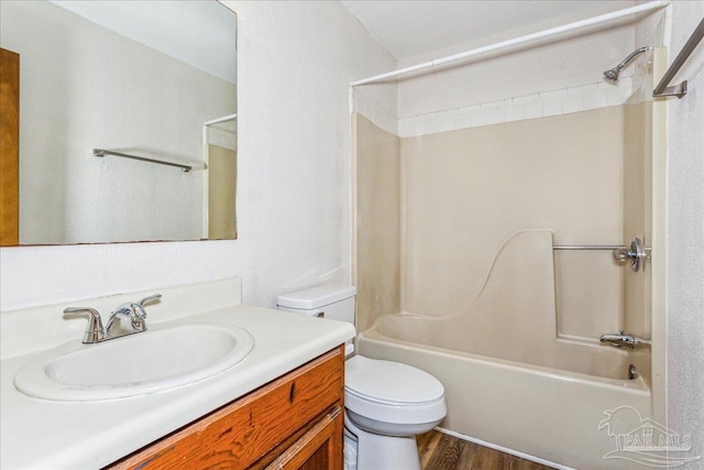 full bathroom with vanity, wood-type flooring, toilet, and shower / bath combination