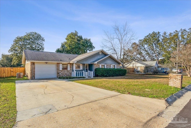 single story home featuring a garage, central AC unit, covered porch, and a front lawn