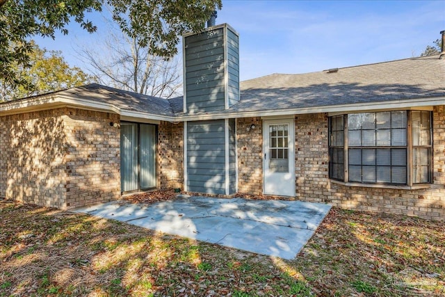 back of house with a patio area