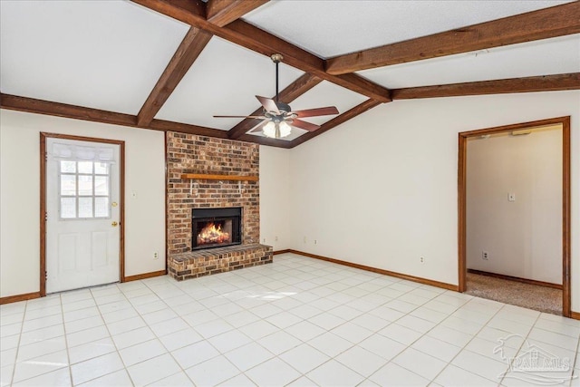 unfurnished living room with light tile patterned flooring, vaulted ceiling with beams, ceiling fan, and a fireplace