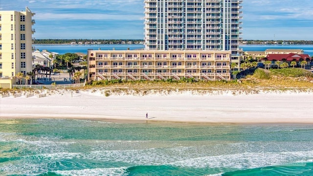 aerial view featuring a water view and a beach view