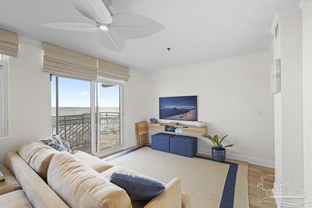 living room featuring light wood-type flooring and ceiling fan