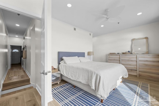 bedroom featuring ceiling fan and hardwood / wood-style floors