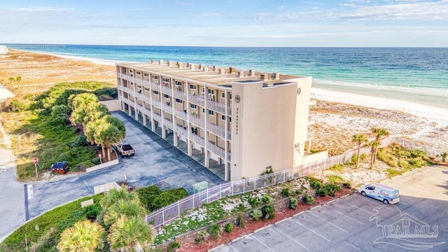 birds eye view of property with a view of the beach and a water view