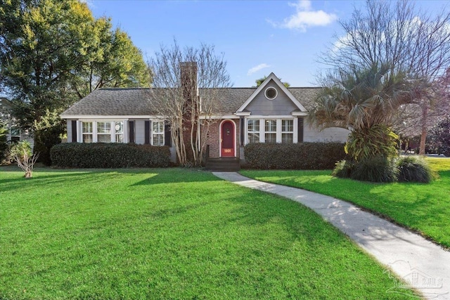 ranch-style house featuring a front yard