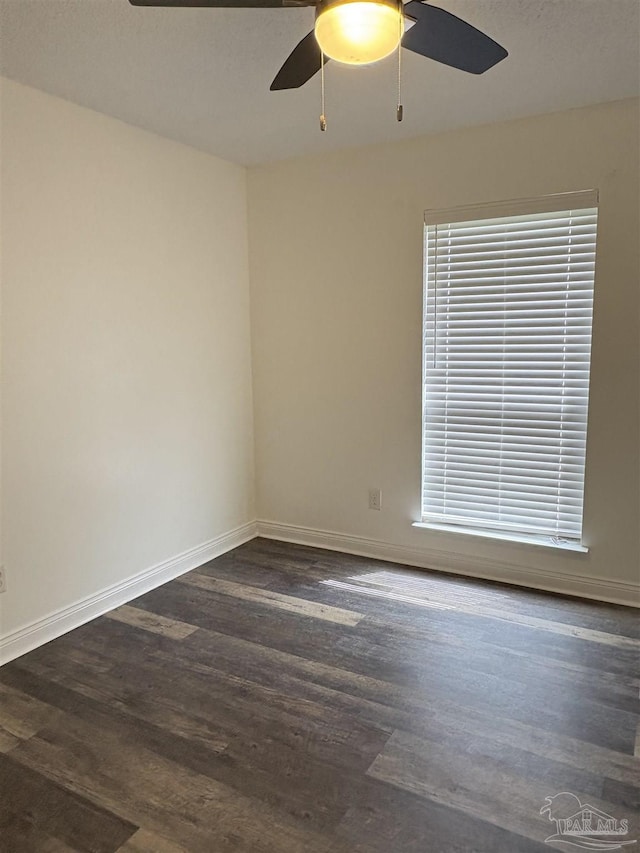 2654 Tinosa Cir, Pensacola, FL 32526 - unfurnished room featuring a ceiling fan and dark wood-style flooring
