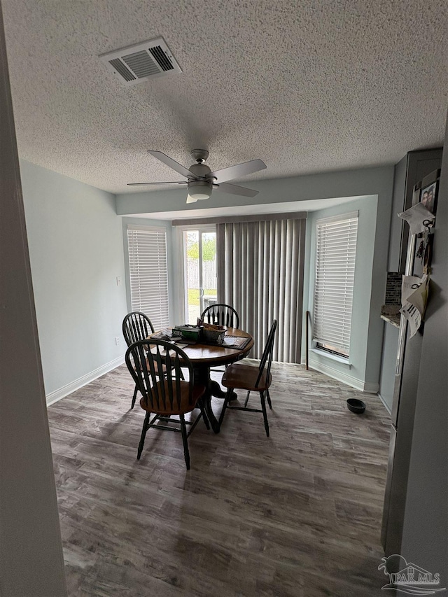 2654 Tinosa Cir, Pensacola, FL 32526 - dining room with a textured ceiling, dark wood finished floors, and ceiling fan