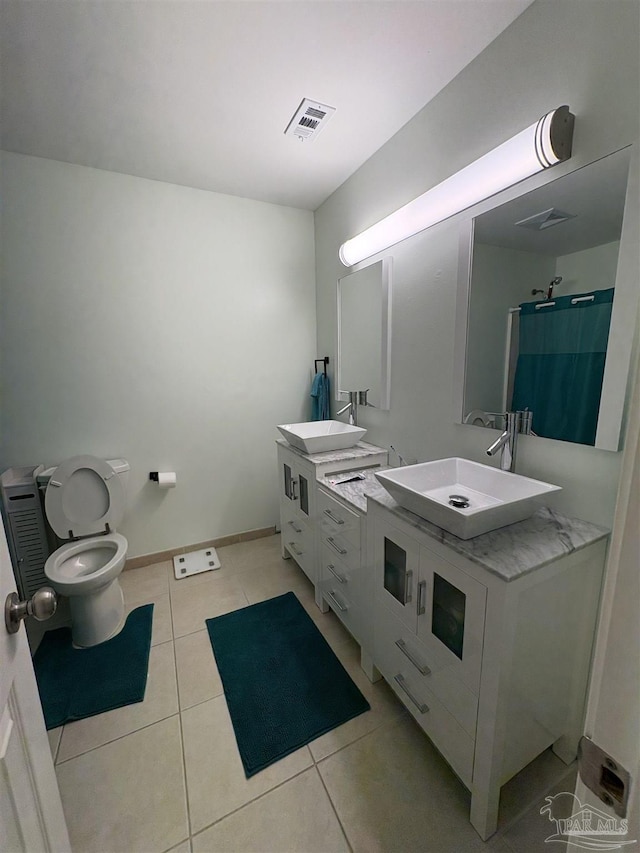 2654 Tinosa Cir, Pensacola, FL 32526 - bathroom with double vanity, tile patterned flooring, and a shower with curtain