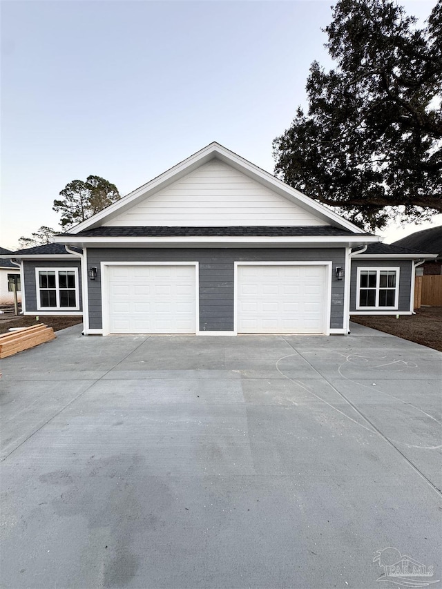 ranch-style home featuring a garage