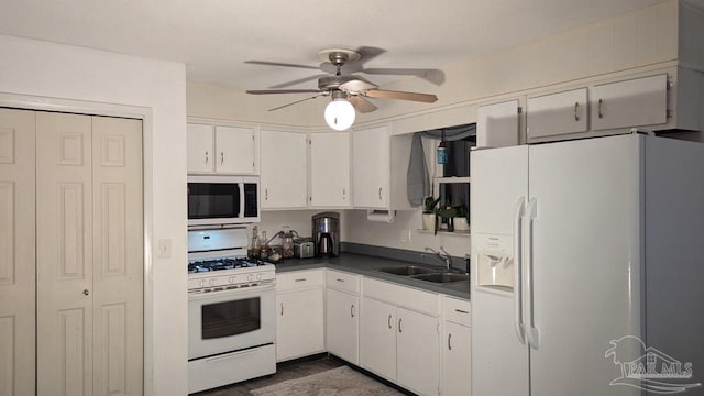 kitchen with a textured ceiling, white appliances, ceiling fan, sink, and white cabinets