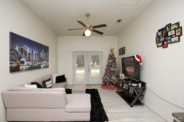 living room with ceiling fan, french doors, and hardwood / wood-style floors