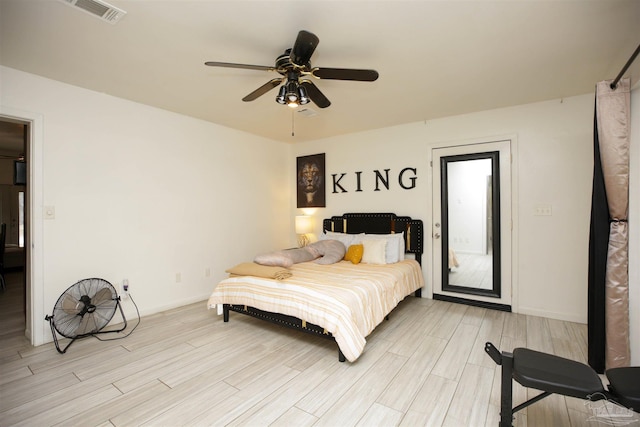 bedroom with light wood-type flooring and ceiling fan