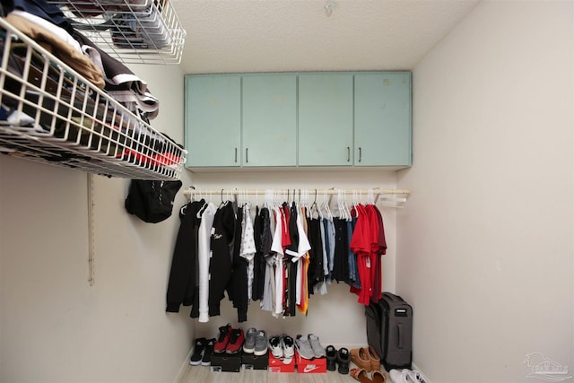 mudroom with a textured ceiling