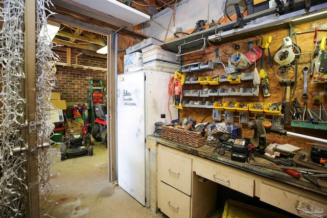 kitchen with concrete flooring and brick wall