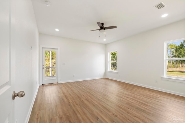 unfurnished room featuring recessed lighting, baseboards, and light wood finished floors