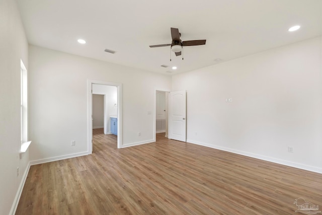 unfurnished bedroom with light wood-type flooring, ceiling fan, baseboards, and recessed lighting