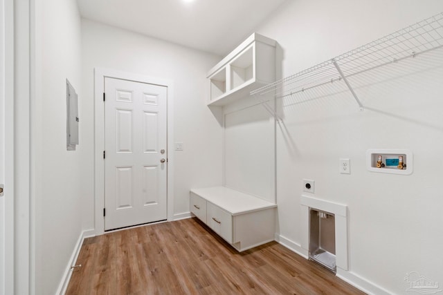 laundry room with hookup for a washing machine, laundry area, baseboards, light wood-style floors, and electric dryer hookup