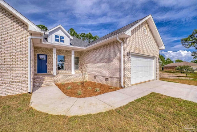 view of front facade with crawl space, brick siding, driveway, and an attached garage