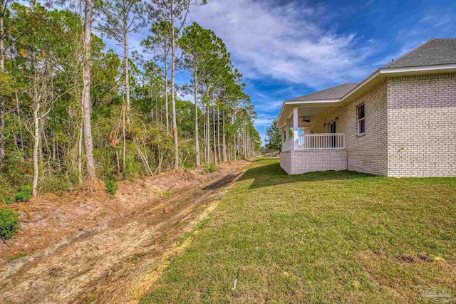 view of yard featuring ceiling fan