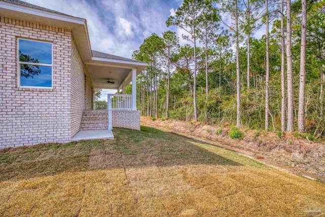 view of yard featuring ceiling fan