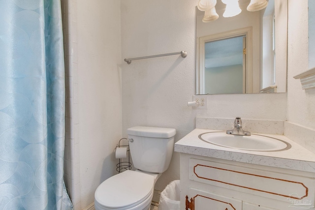 4551 Creighton Rd, Pensacola, FL 32504 - full bath with toilet, a shower with curtain, and vanity