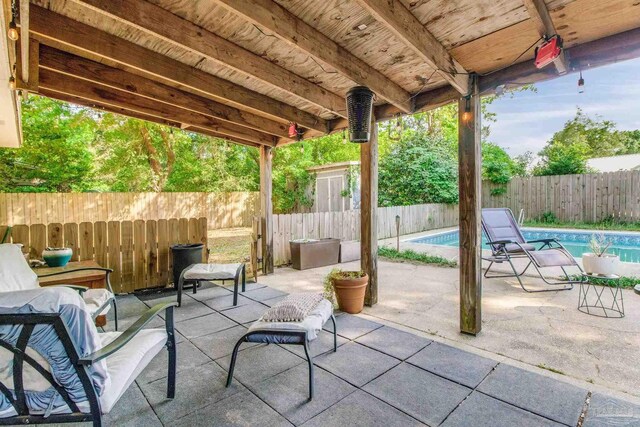 4551 Creighton Rd, Pensacola, FL 32504 - view of patio with a fenced in pool and a fenced backyard