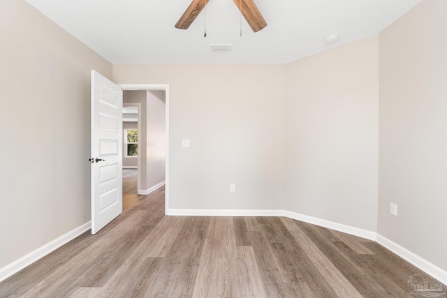 unfurnished room with ceiling fan and light hardwood / wood-style floors