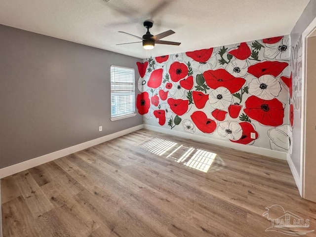 unfurnished bedroom with hardwood / wood-style flooring and ceiling fan