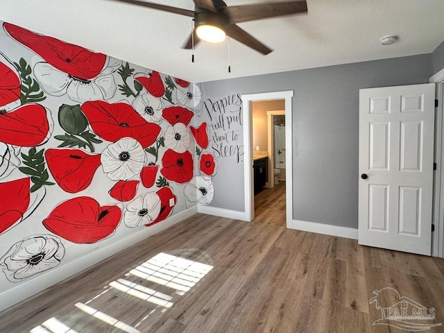 bedroom with wood-type flooring and ceiling fan