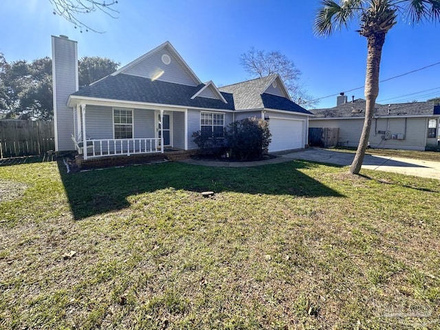 view of front of property with a porch, a garage, and a front lawn