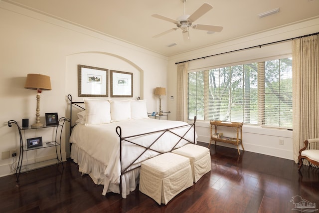 9 N Sunset Blvd, Gulf Breeze, FL 32561 - bedroom featuring crown molding, dark wood finished floors, multiple windows, and ceiling fan