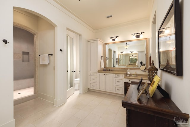 9 N Sunset Blvd, Gulf Breeze, FL 32561 - full bathroom with tile patterned floors, ornamental molding, vanity, and tiled shower