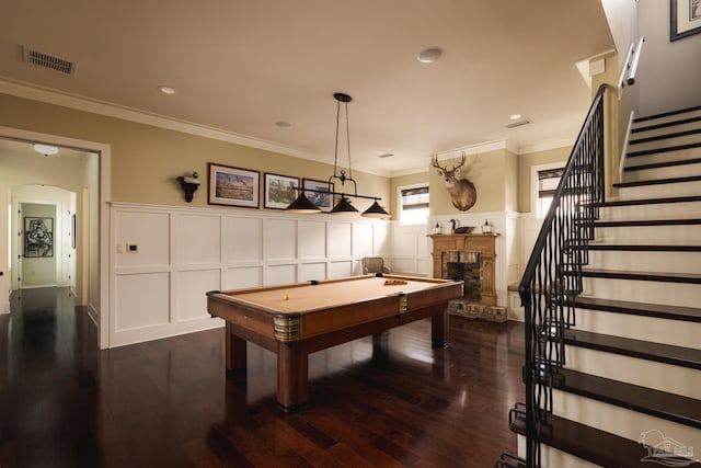 9 N Sunset Blvd, Gulf Breeze, FL 32561 - game room featuring a decorative wall, billiards table, a fireplace with raised hearth, dark wood-type flooring, and arched walkways