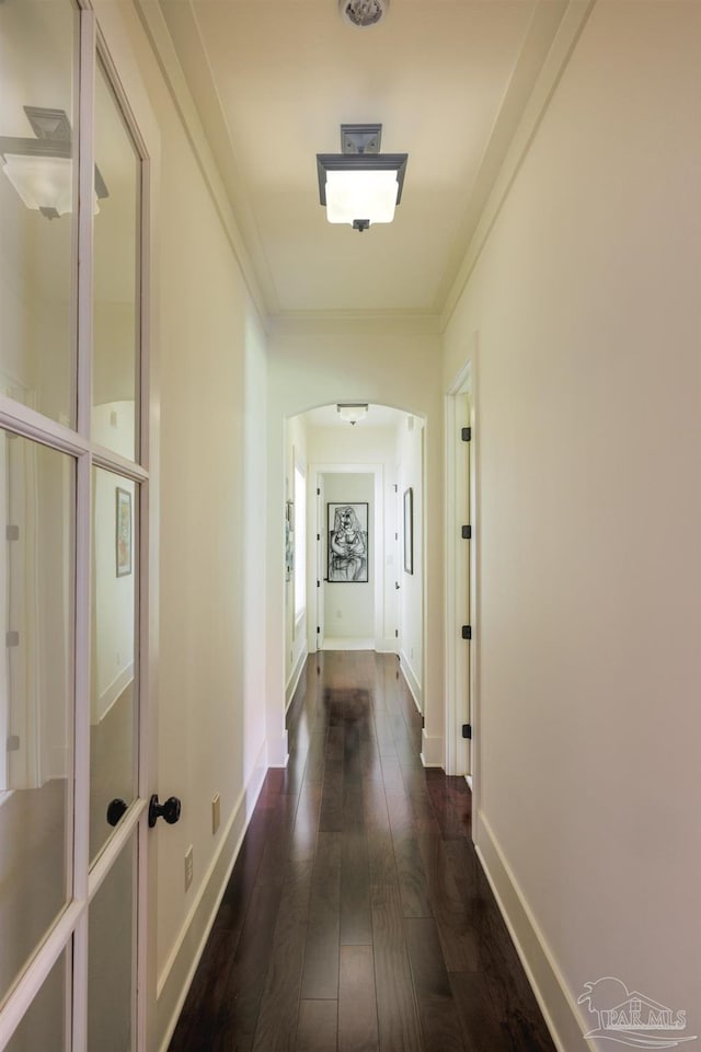 9 N Sunset Blvd, Gulf Breeze, FL 32561 - hall featuring dark wood-type flooring, ornamental molding, and arched walkways