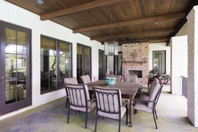 9 N Sunset Blvd, Gulf Breeze, FL 32561 - view of patio featuring an outdoor brick fireplace, outdoor dining area, and a ceiling fan