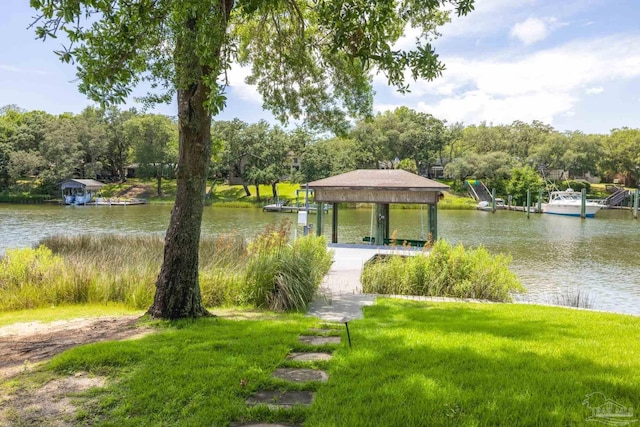 9 N Sunset Blvd, Gulf Breeze, FL 32561 - surrounding community with a water view, a dock, and a yard