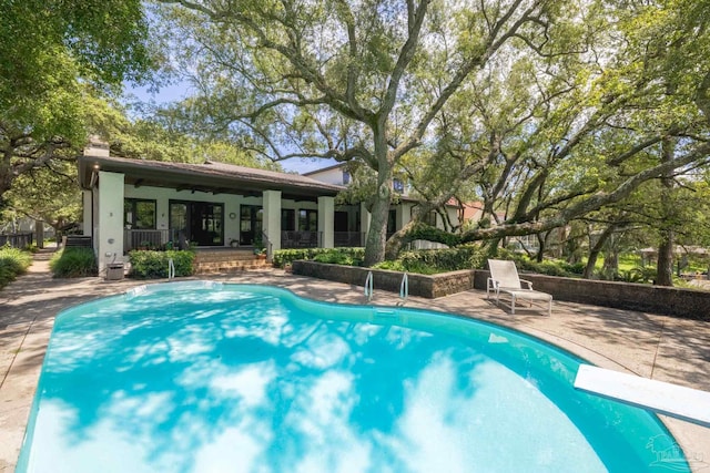 9 N Sunset Blvd, Gulf Breeze, FL 32561 - swimming pool with a patio area, ceiling fan, and a diving board
