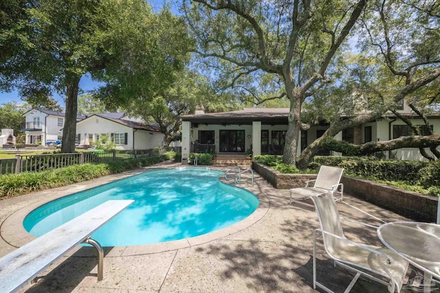 9 N Sunset Blvd, Gulf Breeze, FL 32561 - view of swimming pool featuring a patio and a diving board
