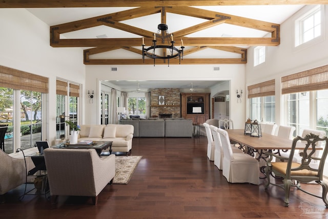 9 N Sunset Blvd, Gulf Breeze, FL 32561 - living area featuring high vaulted ceiling, beamed ceiling, a chandelier, dark wood-style flooring, and a fireplace