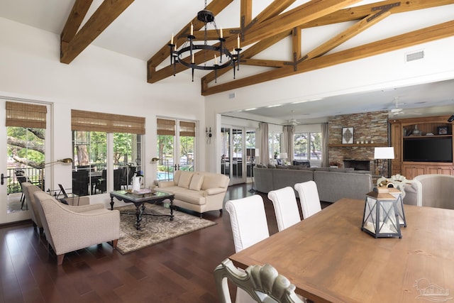 9 N Sunset Blvd, Gulf Breeze, FL 32561 - dining space featuring high vaulted ceiling, a chandelier, beam ceiling, healthy amount of natural light, and dark wood-style flooring